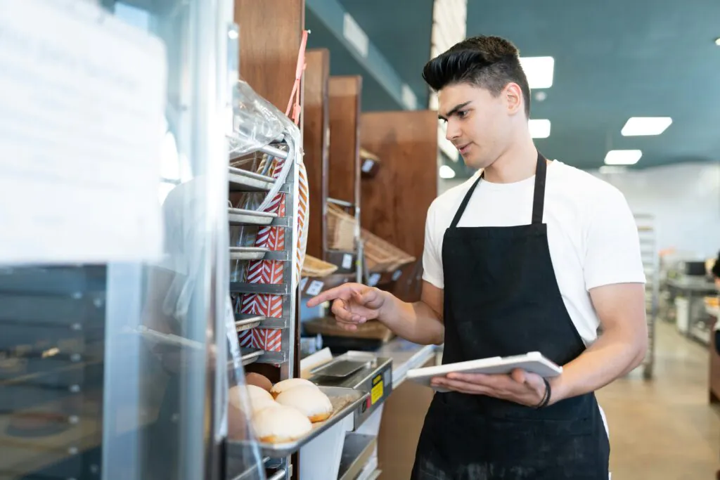 Restaurant staff member counting inventory